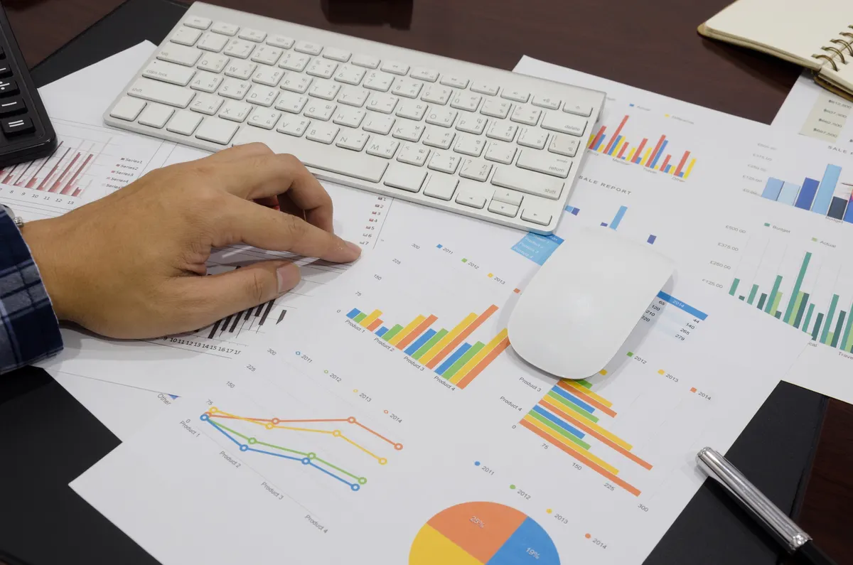 Illustrative photograph of financial reports on a desk